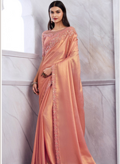 Nakshatra Pretty Peach Colored saree