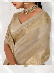 Nakshatra Beige Gold Tissue Linen Saree with Zardosi Handwork & Embellished Pallu