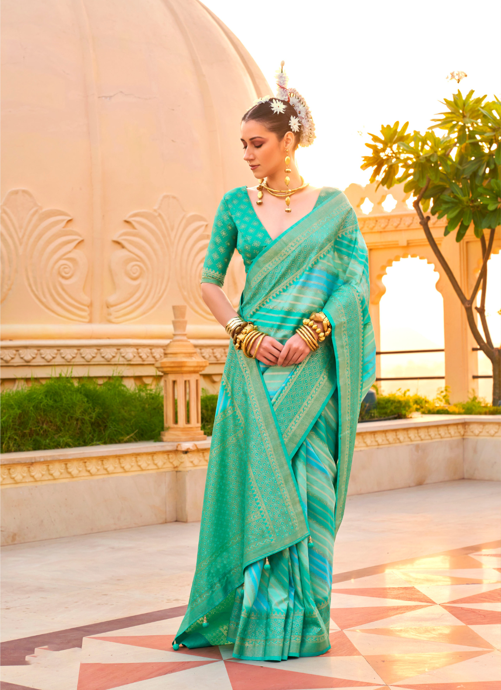 Nakshatra Teal Green Printed Saree