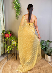 Nakshatra Yellow Embellished Sequence Saree