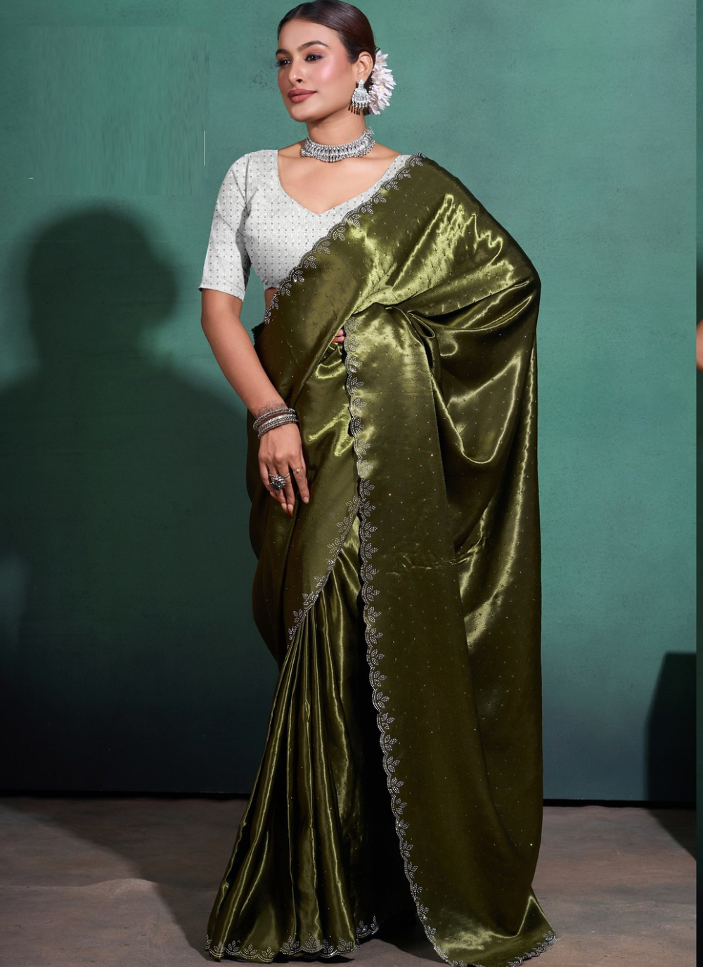 Nakshatra  Diamond studded Olive Green saree.