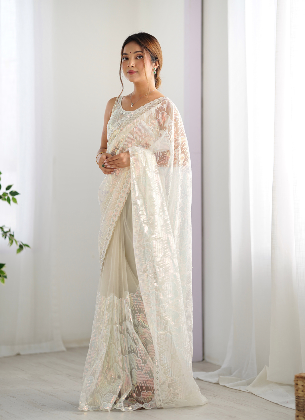 Nakshatra Cream Embellished Net Saree