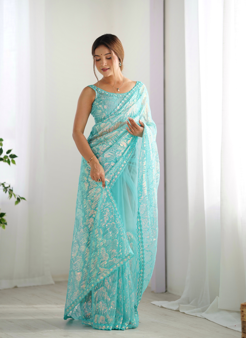 Nakshatra Sky Blue Embellished Net Saree