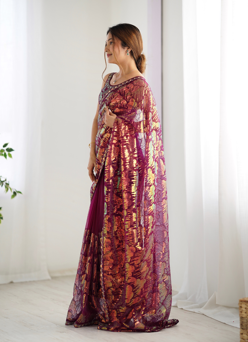 Nakshatra Wine Embellished Net Saree