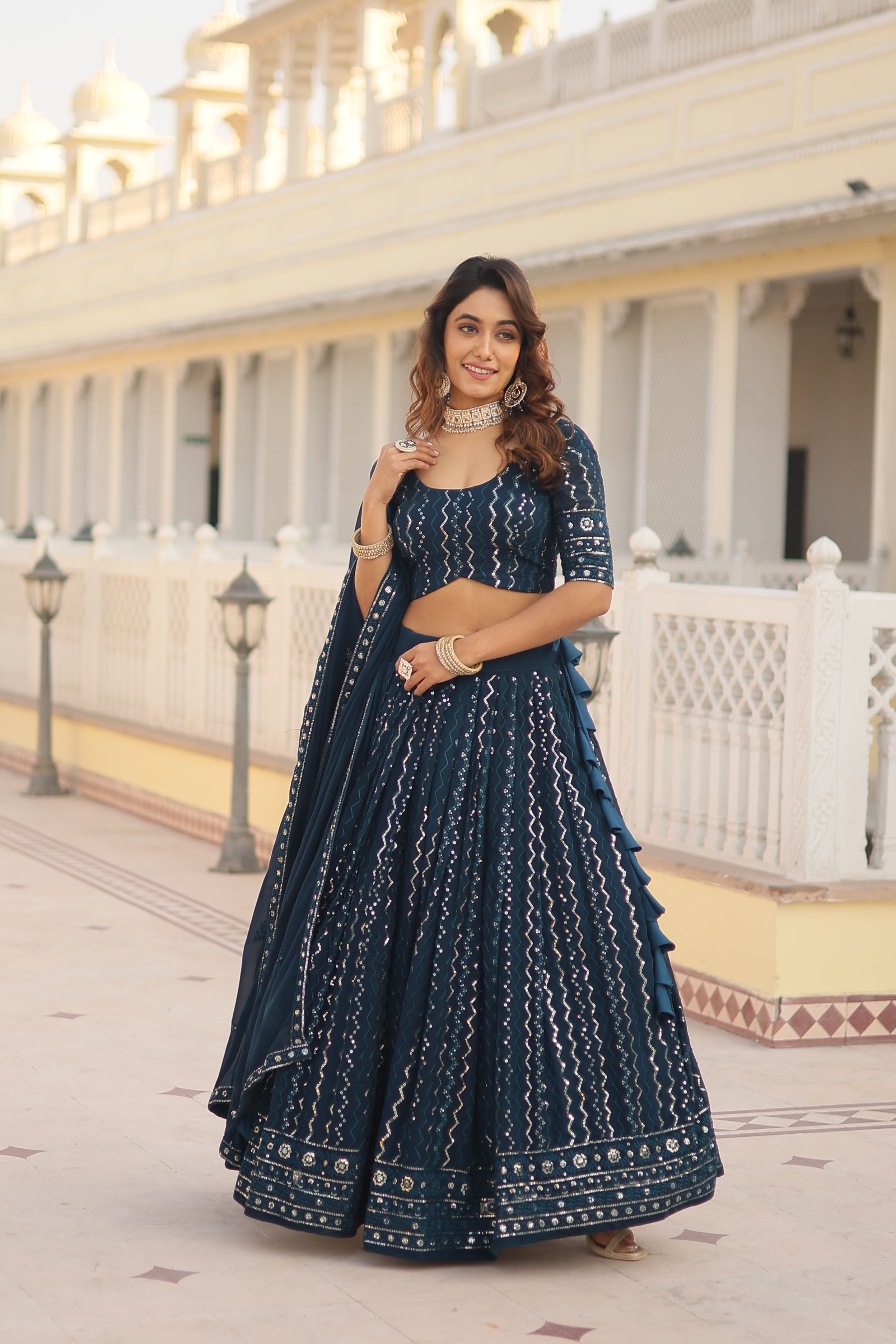 Nakshatra Sequined Teal Blue Lehenga.