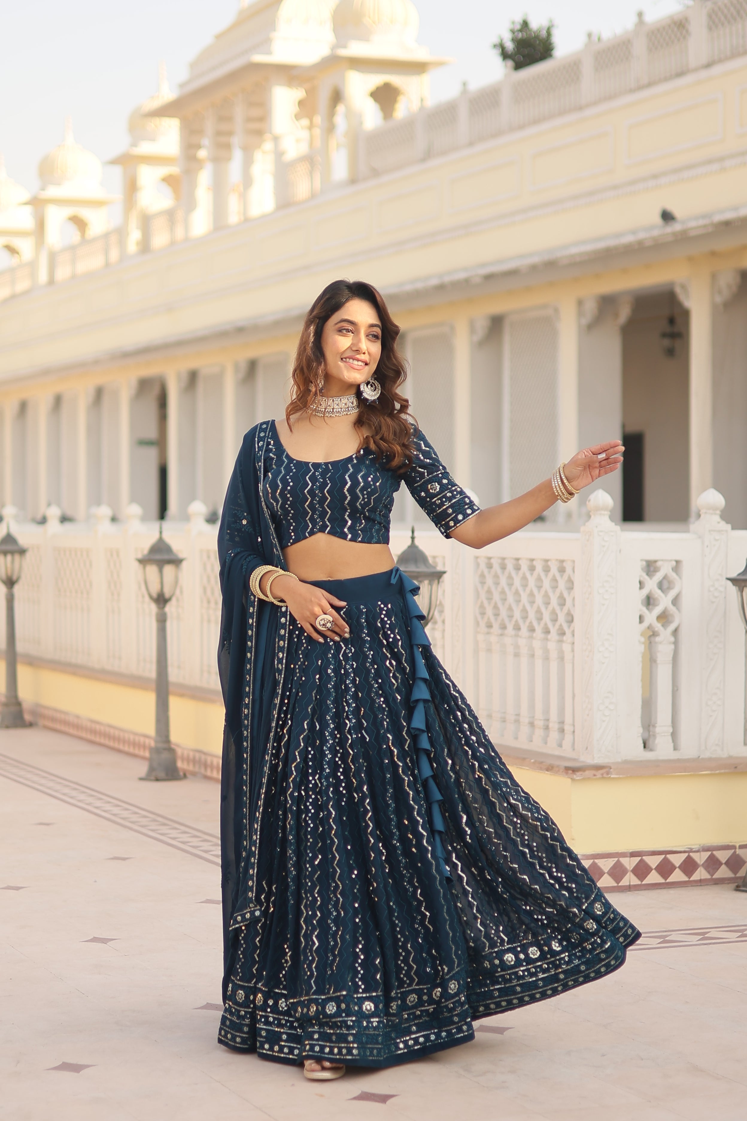 Nakshatra Sequined Teal Blue Lehenga.